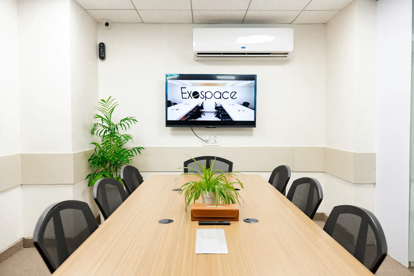 A modern conference room with a tv.